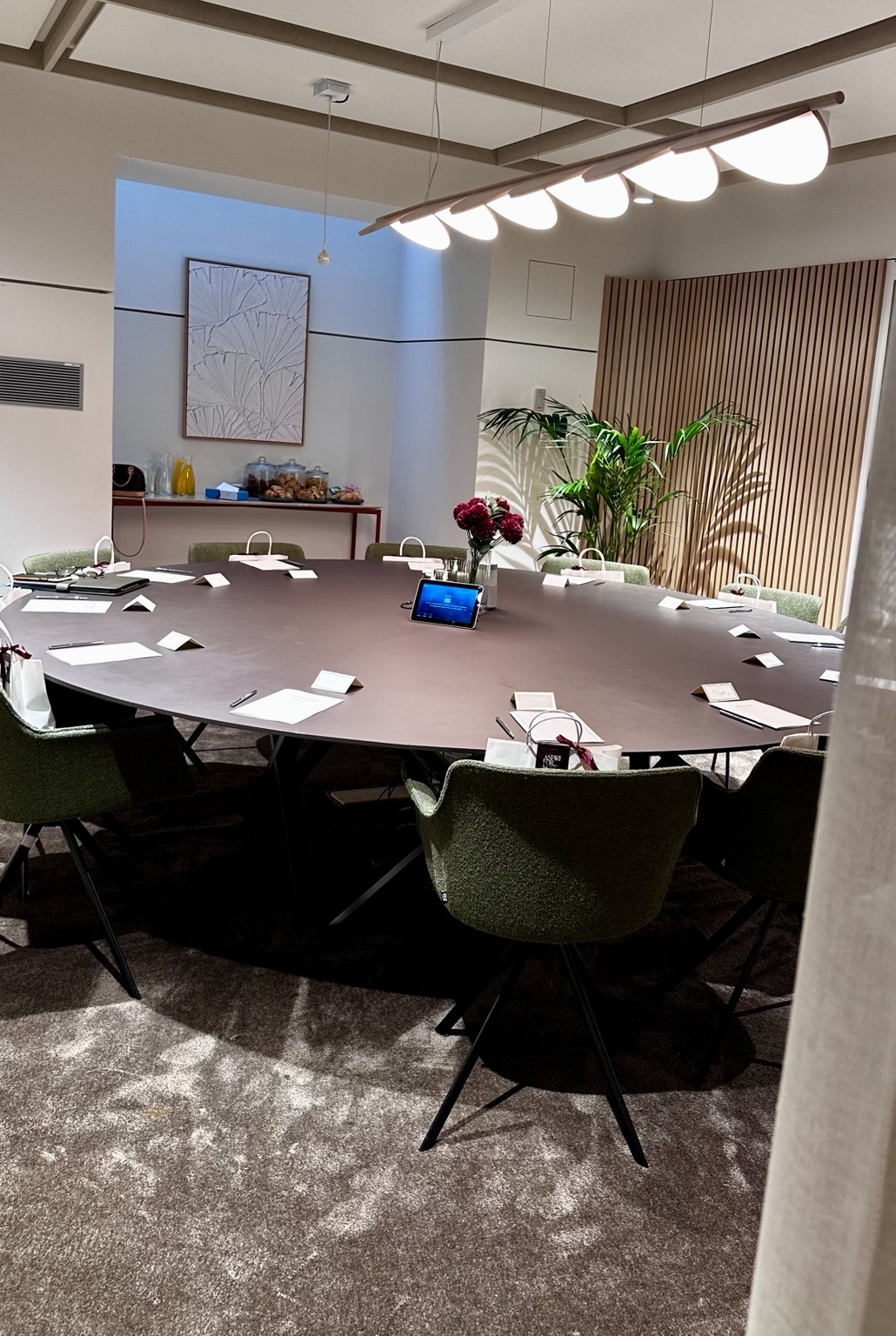 The prepared round table for The Return Experience, with journals, name cards and flowers